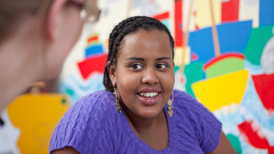 A woman smiling in a clinic